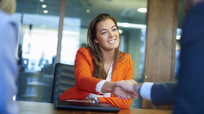 a young graduate sits across the table from her interview panel full of confidence and positive energy. iStock photo for BLA Careers and Employment Expo feature. Cairns Post.