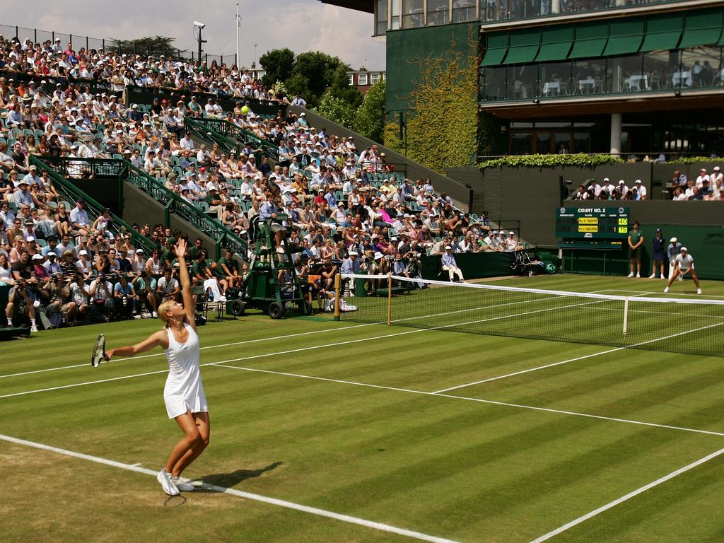 Maria Sharapova serves to Ashley Harkleroad during their match at Wimbledon in 2003.