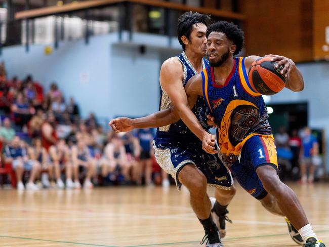 Jerron Jamerson under pressure from Ansett’s Henry Bui. Picture: Che Chorley