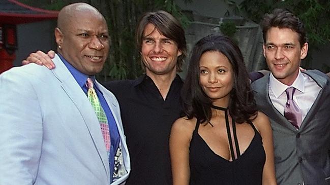 Big smiles and not a zit in sight: Mission: Impossible 2 stars (L) Ving Rhames, Tom Cruise, Thandie Newton and Dougray Scott at the Hollywood premiere in 2000. Picture: AP PicKevork/Djansezian