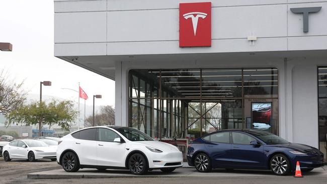 CORTE MADERA, CALIFORNIA - DECEMBER 20: Tesla models Y and 3 are displayed at a Tesla dealership on December 20, 2024 in Corte Madera, California. Electric car maker Tesla is recalling 700,000 vehicles over a tire pressure warning system that could fail to warn drivers of low tire pressure. 2024 Cybertrucks, 2017-2025 Model 3 and 2020-2025 Model Y are being recalled.   Justin Sullivan/Getty Images/AFP (Photo by JUSTIN SULLIVAN / GETTY IMAGES NORTH AMERICA / Getty Images via AFP)