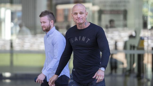 Nick 'The Knife' Forbes (right) is seen leaving Brisbane Supreme Court, Brisbane, Monday, September 9, 2019. (AAP Image/Glenn Hunt)