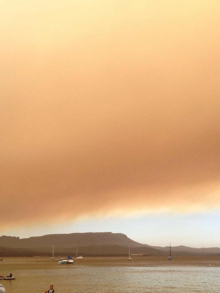 Smoke haze hangs over the beach at Coningham. Picture: ZIAH COOPER