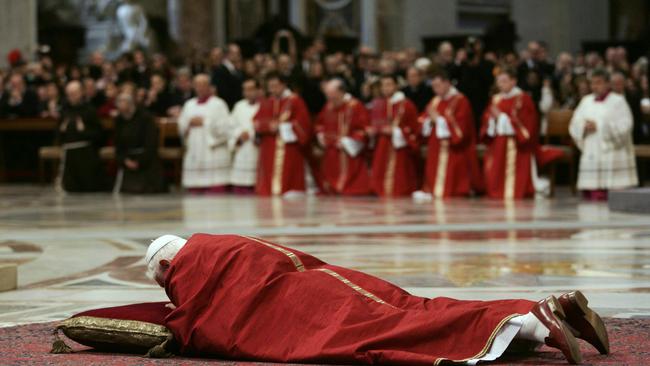 Benedict XVI prays during the Good Friday service in Saint Peter's in 2007. Picture: AFP / Pool