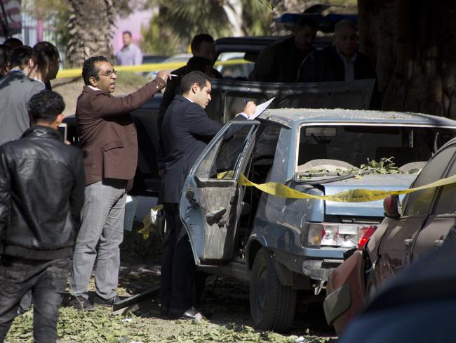 Egyptian explosives experts look for evidence at the site of a bomb explosion in Cairo, Egypt. Picture: AP
