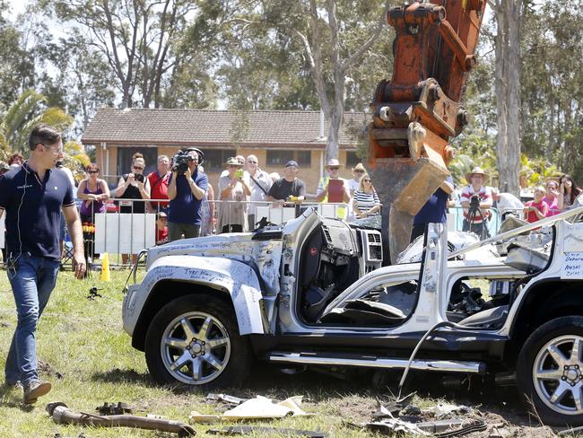 Mr Wood oversees the dismembering of his lemon Jeep. Picture: Megan Slade