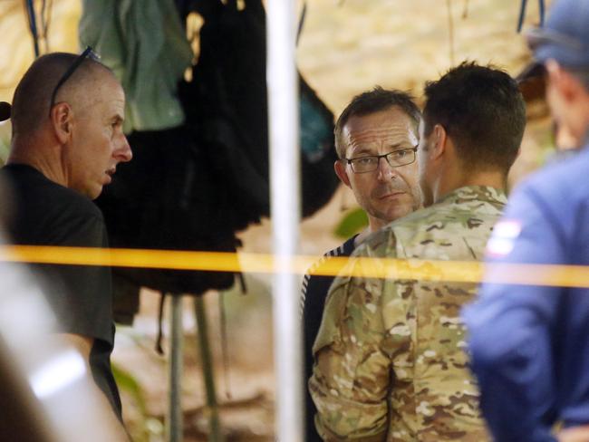 British divers Richard Stanton and John Volanthen talk to US Special Operations Command Pacific Search and Rescue team personnel in Mae Sai, Chiang Rai province.