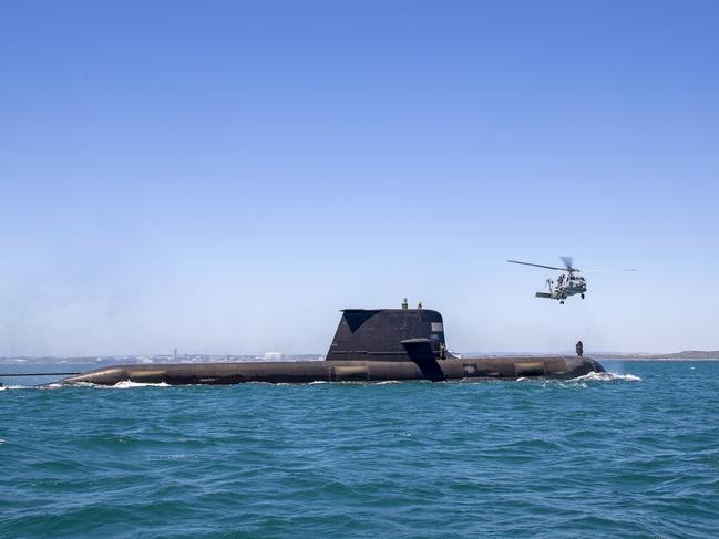 COCKBURN SOUND, AUSTRALIA - FEBRUARY 12: In this handout image provided by the Australian Defence Force, Royal Australian Navy submarine HMAS Rankin conducts helicopter transfers during a training assessment on February 12, 2021 in Cockburn Sound, Australia. Australia, the United States and the United Kingdom have announced a new strategic defence partnership - known as AUKUS - to build a class of nuclear-propelled submarines and work together in the Indo-Pacific region. The new submarines will replace the Royal Australian Navy's existing Collins submarine fleet. (Photo by LSIS Richard Cordell/Australian Defence Force via Getty Images)