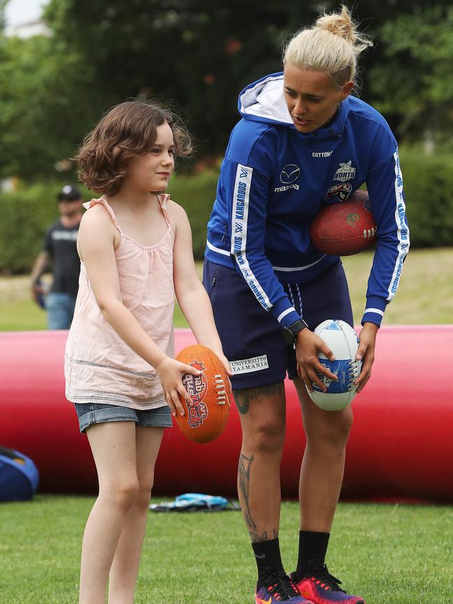 Nina Johnston, 7, of Hobart, with AFLW North Melbourne player Moana Hope. Picture: NIKKI DAVIS-JONES