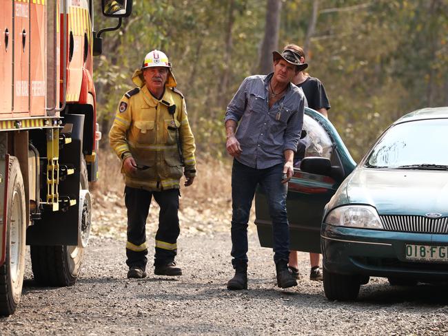 Firefighters battle bushfires in Busbys Flat, northern NSW, Wednesday, October 9, 2019. (AAP Image/Jason O'Brien)