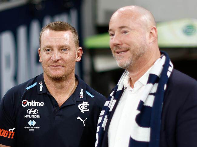 MELBOURNE, AUSTRALIA - MARCH 14: Michael Voss, Senior Coach of the Blues and President Luke Sayers celebrate during the 2024 AFL Round 01 match between the Carlton Blues and the Richmond Tigers at the Melbourne Cricket Ground on March 14, 2024 in Melbourne, Australia. (Photo by Michael Willson/AFL Photos via Getty Images)