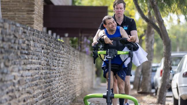 Edward Cheesman, pictured with physiotherapist Adam Lidiard, is running in the City-Bay for the first time to raise money for Make-A-Wish Australia. Picture: Kelly Barnes