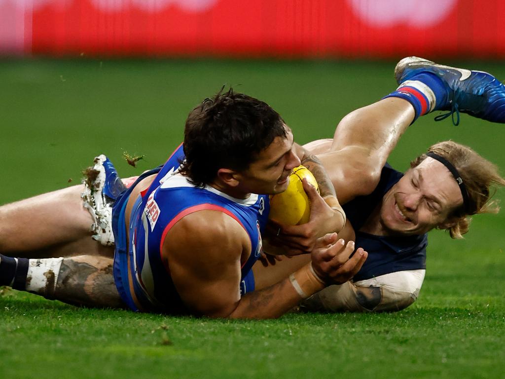 Tom Stewart tangles with Jamarra Ugle-Hagan. Picture: Michael Willson/AFL Photos via Getty Images