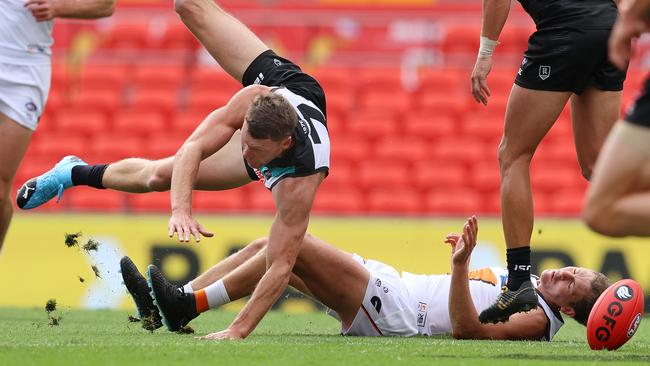 Port Adelaide’s Brad Ebert lays out GWS’ Harry Perryman during Sunday’s clash. Picture: Michael Klein