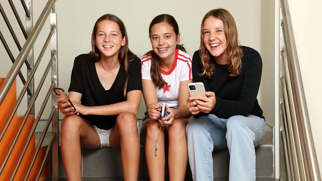 Teenagers Frankie Gibson, Maeya Cassim and Hazel Easter say it’s easy to get stuck scrolling on social media. Picture: Tim Hunter.