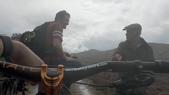 King Charles bumps into cyclists on solo hike