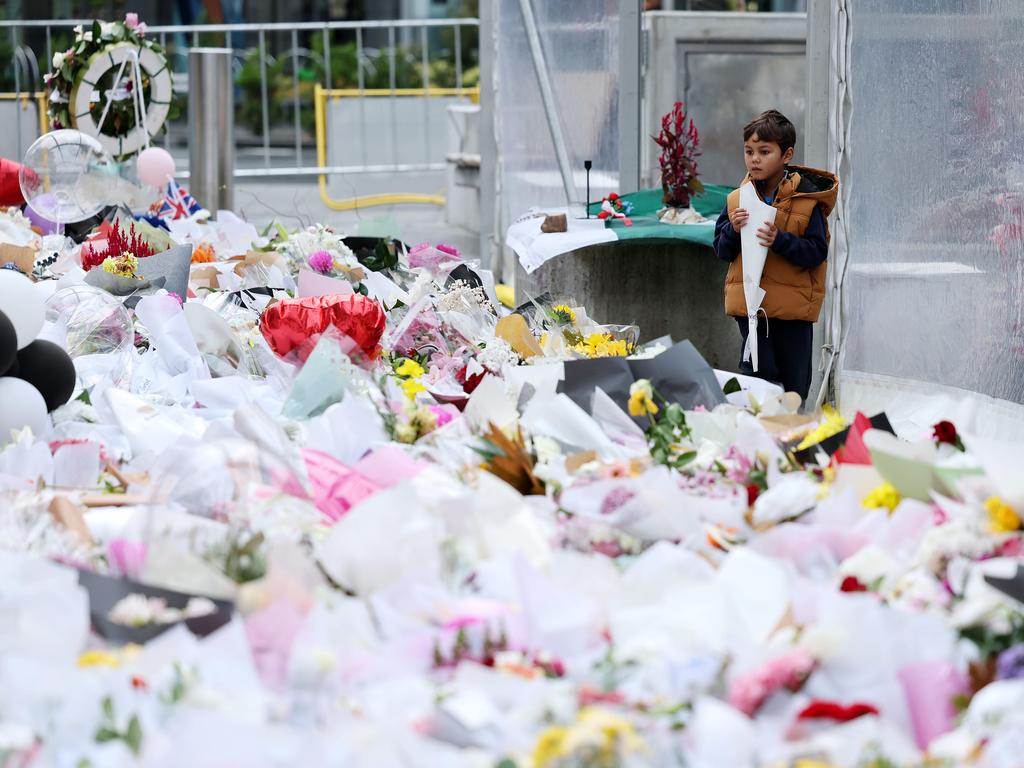 <p>Tane Poi-Emch, five, at the floral tribute outside Westfield Bondi Junction one week after the devastating stabbing attack last Saturday. Photo: Tim Hunter.</p>