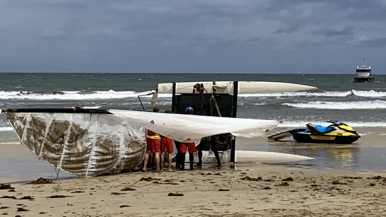 The boat left on the shoreline as the sailor was rescued.