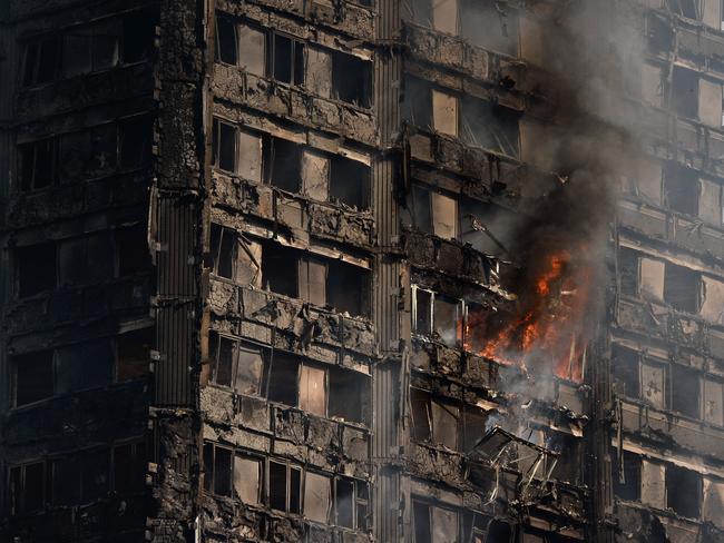 Debris falls from the burning 24-storey residential tower block. Picture: Chris J Ratcliffe/Getty Images