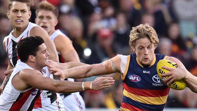 Rory Sloane breaks away from Leigh Montagna of the Saints. Mark Ricciuto says Sloane could walk away with this year’s Brownlow Medal. Picture: Daniel Kalisz (Getty Images)