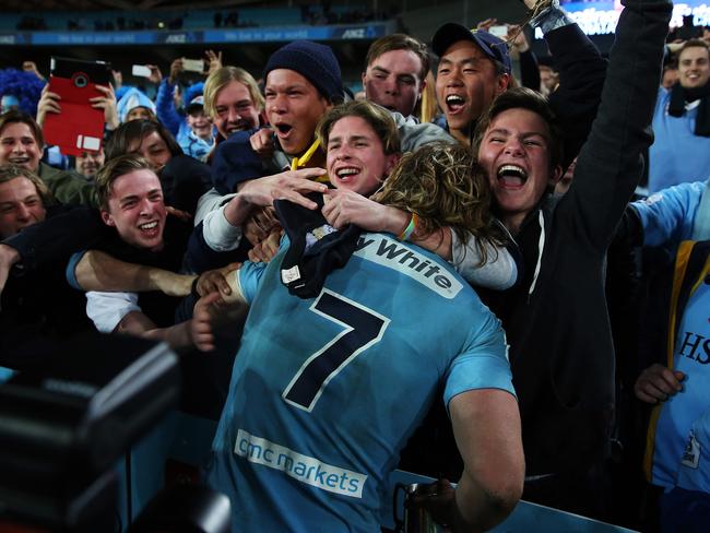 Michael Hooper is mobbed by Waratahs fans.