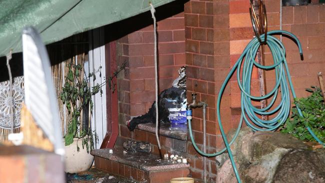 Police established a crime scene at a home in Canterbury after an explosive device ignited in the face of a woman. Pics Bill Hearne