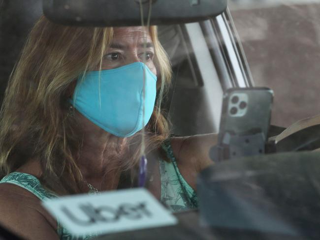 LOS ANGELES, CALIFORNIA - AUGUST 20: An Uber driver participates in a car rally by Uber and Lyft drivers calling for basic employment rights at Los Angeles International Airport (LAX) amid the COVID-19 pandemic on August 20, 2020 in Los Angeles, California. An appeals court granted Lyft and Uber an emergency stay from needing to classify drivers as employees allowing ride-sharing services to continue after a threatened shutdown in California.   Mario Tama/Getty Images/AFP == FOR NEWSPAPERS, INTERNET, TELCOS & TELEVISION USE ONLY ==