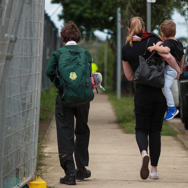 A parent collecting her child at the catholic school. Picture: Justin Lloyd