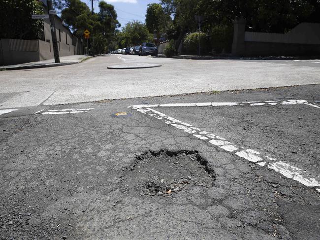 $500m will be spent on fixing potholes, like this one on the corner of Newington and Wemyss streets in Marrickville. Picture: John Appleyard