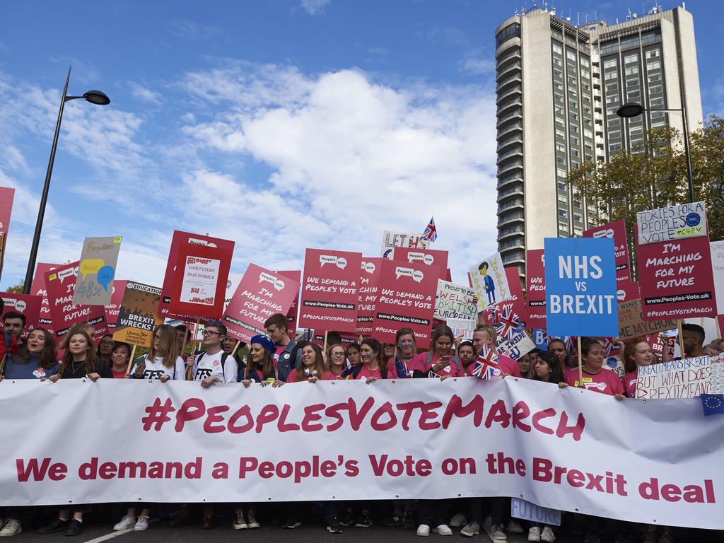 Demonstrators hold placards as they take part in a march calling for a People's Vote on the final Brexit deal, in central London on October 20, 2018. Picture: AFP