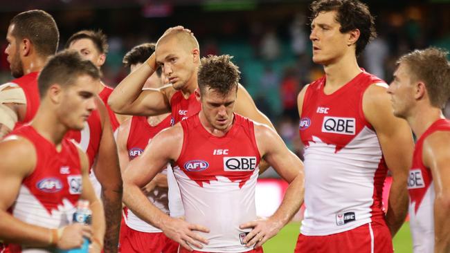 SYDNEY, AUSTRALIA — APRIL 22: Swans players look dejected after the round five AFL match between the Sydney Swans and the Greater Western Sydney Giants at Sydney Cricket Ground on April 22, 2017 in Sydney, Australia. (Photo by Matt King/AFL Media/Getty Images)