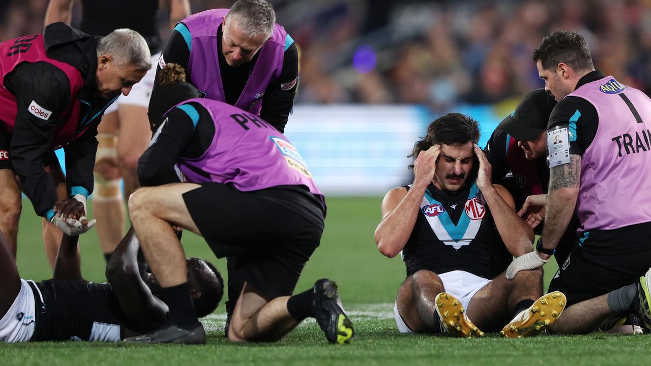 Aliir Aliir and Lachie Jones did not immediately enter concussion protocols despite a heavy collision during the Showdown on Saturday night. Picture: Sarah Reed / Getty Images