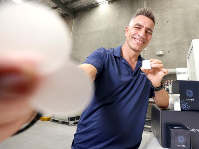 Rimas Kairaitis, the Managing Director Alpha HPA, holding Ultra-High Purity Alumina Tablets and Ultra Sapphire Wafers, Murarrie, on Monday 12th February 2024 - Photo Steve Pohlner