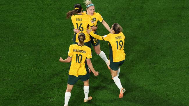 Hayley Raso of Australia celebrates with teammates after scoring against Denmark