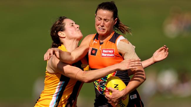 Former Queenwood student Nicola Barr of the Giants (right) contests the ball during an AFLW match against Hawthorn last season. Picture: Brendon Thorne/Getty Images