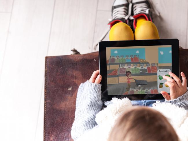 The AEIOU Foundation was established in 2005 to provide early intervention for children aged between 2 and 6 with an autism diagnosis. Here a child plays an app called ‘Let’s Go Shopping’, which is designed to familiarise autistic children with a supermarket.