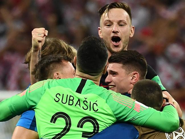 Croatia's players celebrate their win at the end of the Russia 2018 World Cup semi-final football match between Croatia and England at the Luzhniki Stadium in Moscow on July 11, 2018. Croatia will play France in the World Cup final after they beat England 2-1 in extra-time on Wednesday thanks to a Mario Mandzukic goal in the second period of extra-time. / AFP PHOTO / FRANCK FIFE / RESTRICTED TO EDITORIAL USE - NO MOBILE PUSH ALERTS/DOWNLOADS