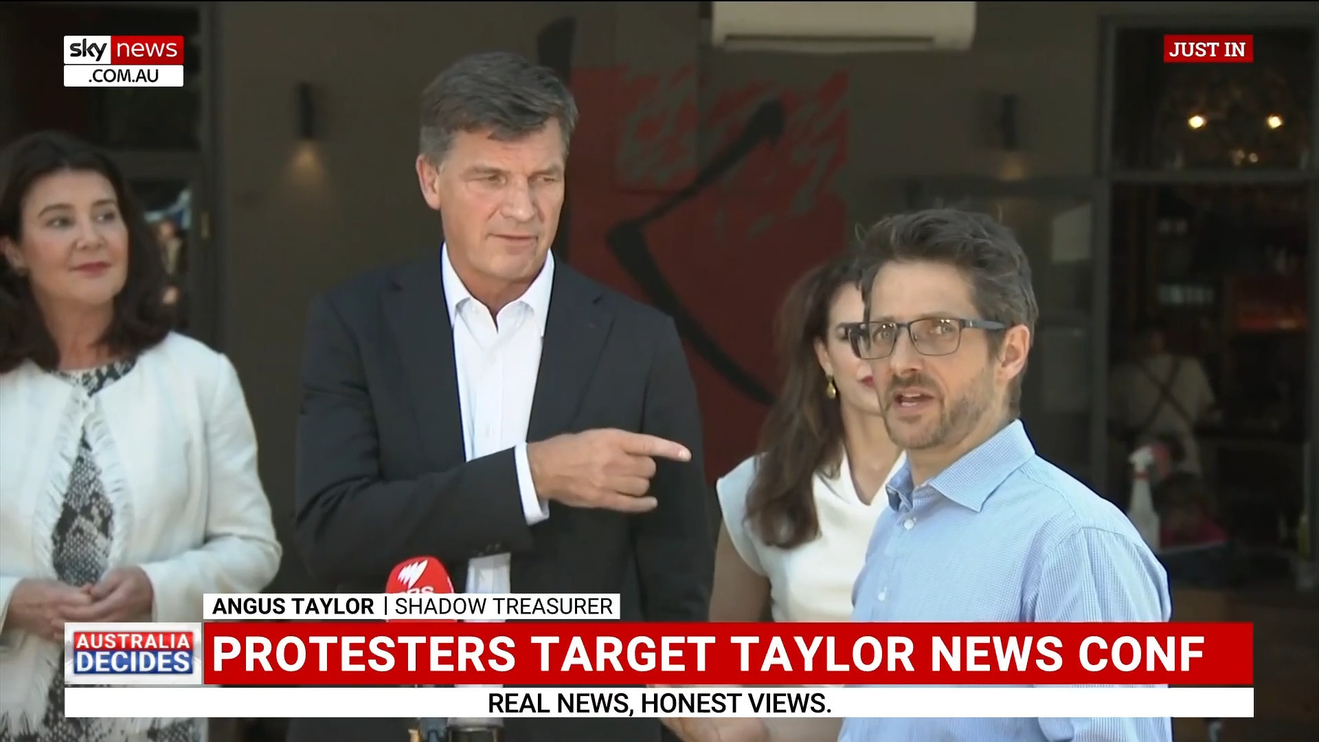 Angus Taylor media conference halted by protesters