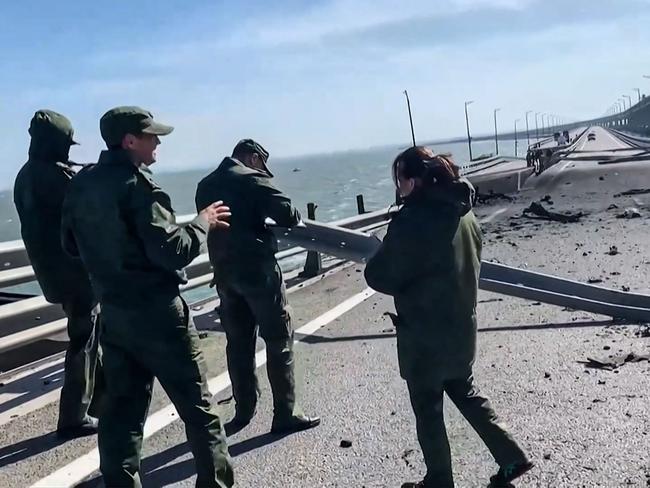 Russian investigators work on the damaged bridge. Picture: AFP