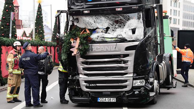 Police and firemen at the scene of the Christmas market crash in Berlin.