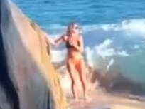 Nicole was posing for a photo when a wave hit.