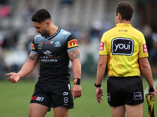 Cronulla's Shaun Johnson looks as his arm where he was bitten by Titans' Kevin Proctor who was sent from the field during the NRL match between the Cronulla Sharks and Gold Coast Titans at Kogarah oval. Picture. Phil Hillyard