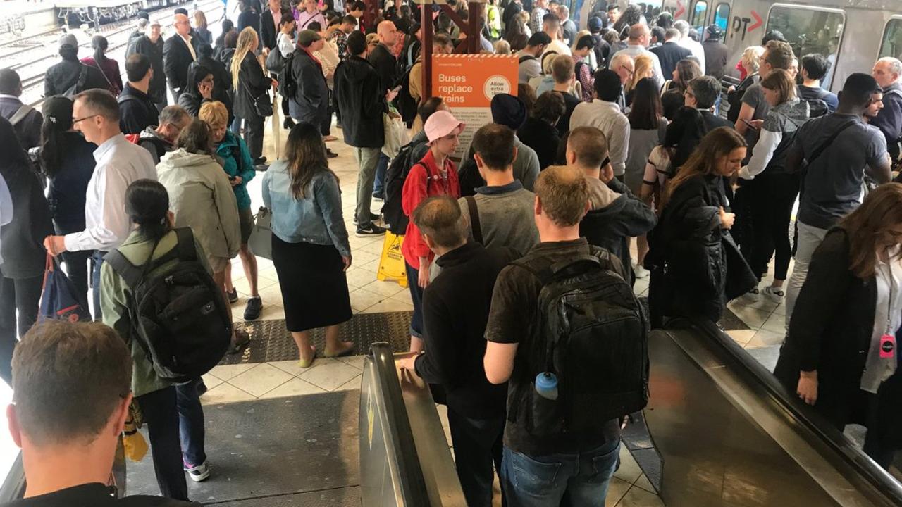 Stranded passengers at Flinders St station after trains were delayed by floodwater. Picture: Wes Hosking