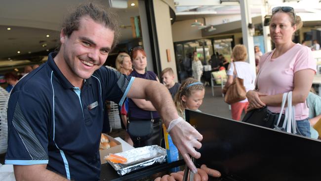 Hayden Lamaro on sausage sizzle duties