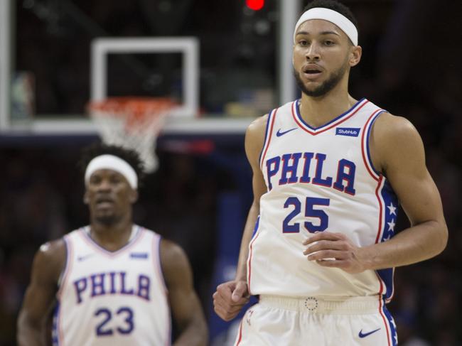 Jimmy Butler and Ben Simmons wearing matching headbands.