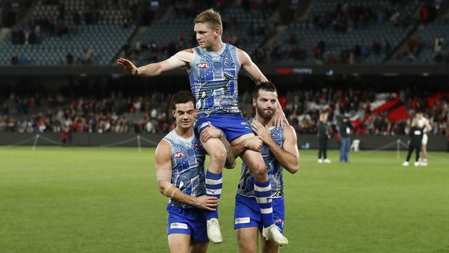 North Melbourne captain Jack Ziebell is carried off after his 250th AFL game. Picture: Darrian Traynor/AFL Photos/Getty Images