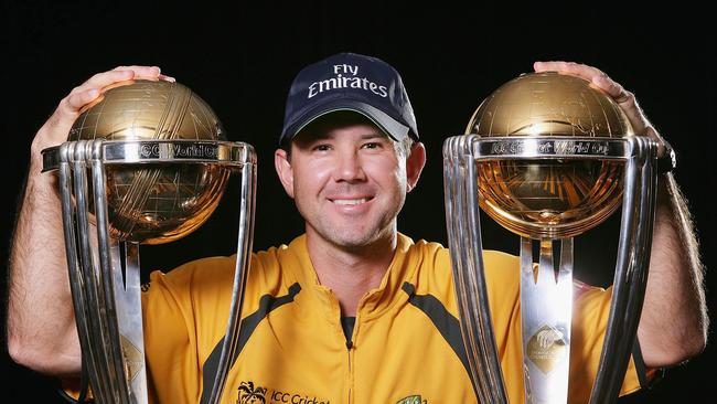 A history of success... Ricky Ponting poses with the 1999 and 2003 World Cup trophies — two of the five Australia has won. Picture: Getty