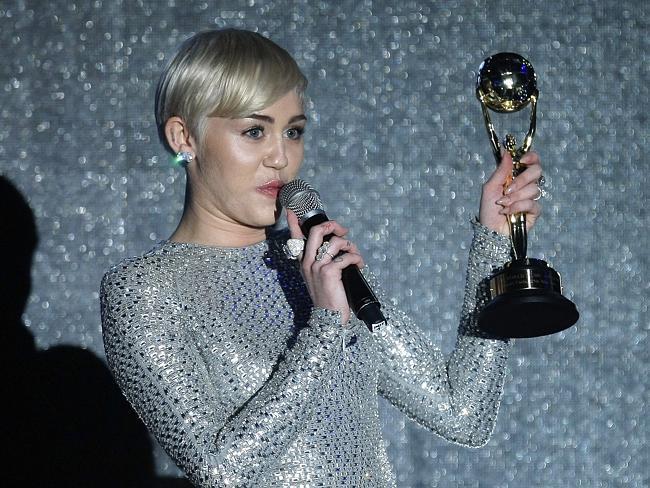 Can’t stop winning ... U.S. singer Miley Cyrus receives an award