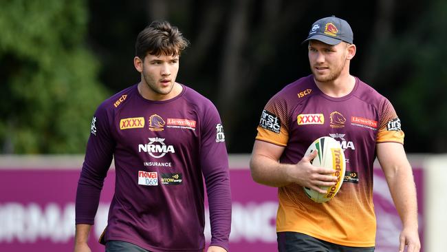 Patrick Carrigan (left) and Matt Lodge (right) are seen during Brisbane Broncos training at Clive Berghofer Field in Brisbane, Friday, June 28, 2019. The Broncos are playing the Knights in their round 15 NRL clash in Newcastle on Saturday. (AAP Image/Darren England) NO ARCHIVING