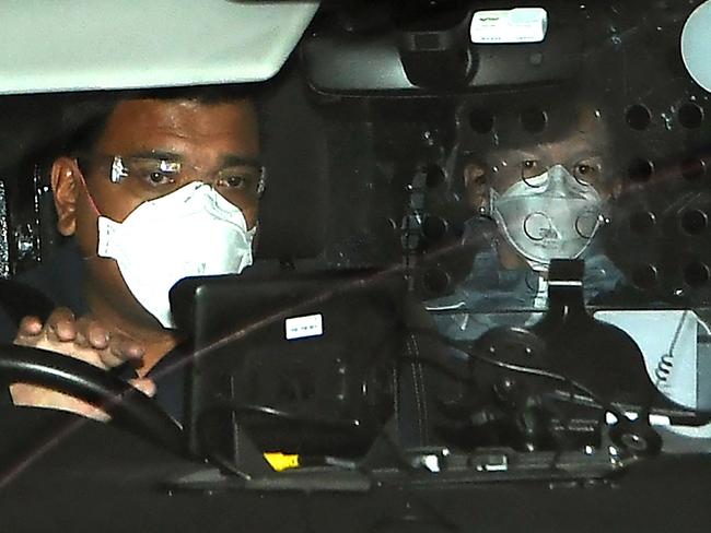 TOPSHOT - A woman believed to be Czech Republic's Renata Voracova (R) looks out from a vehicle as it leaves a government detention centre where Serbia's tennis champion Novak Djokovic is reported to be staying in Melbourne on January 8, 2022, after the Czech government said Australia cancelled the visa of Voracova who entered the country to play in this month's Australian Open. (Photo by William WEST / AFP)